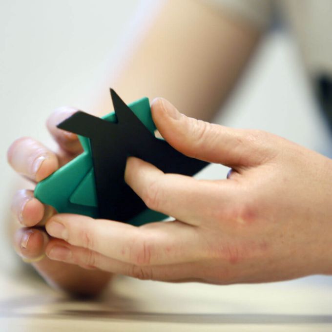 Colourblind pieces held in hand